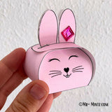 Printable Bunny Basket craft for Easter, featuring a cute pink bunny design. DIY paper basket template for kids’ Easter egg hunts and treat storage. Fun preschool and kindergarten activity.