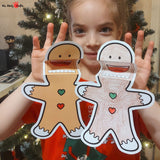Two gingerbread man puppet crafts with movable mouths, one colored and one for coloring, showcasing bow ties and buttons, ready for creative play.