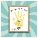 Printable Father’s Day craft for electrician dads featuring a yellow handprint shaped like a light bulb with the phrase “You Light Up My Life.” Fun gift idea for kids to make for their dad who works with electricity or in the trades.