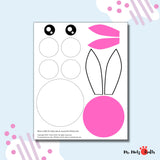 A handmade paper Easter bunny crafted with care, featuring a pink nose, expressive eyes, and whimsical ears. The bunny is placed on a festive surface, ready to bring joy to Easter celebrations.