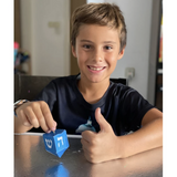 Make an easy Hanukkah craft for kids with this dreidel garland activity. Kids get to make their own decoration using our template!