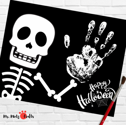 Printable Halloween skeleton handprint craft for kids — spooky black-and-white art featuring a smiling skull and handprint with “Happy Halloween.” Easy printable template for preschool and classroom fun from Mr. Mintz Crafts.
