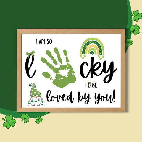 Printable St. Patrick’s Day handprint craft with ‘Lucky to Be Loved’ text. A cute keepsake featuring a rainbow, shamrocks, and a festive gnome.