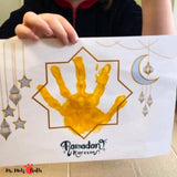 Printable Ramadan Handprint Art Craft with stars and moon, serving as creative Islamic Crafts for Kids or a special Ramadan Gift from Kids to beautify any Ramadan Decor