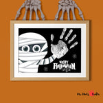 Halloween mummy handprint craft featuring a spooky mummy with big eyes and handprint design. Perfect for kids’ holiday art projects.