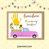 Grandparents Day printable Grandma handprint keepsake featuring a bright pink vintage-style pickup truck carrying yellow sunflowers, a large yellow child handprint growing from a green flower stem, and the message “Grandma, You Are My Sunshine,” designed for kids ages 3–7 to create a personalized sunflower-themed gift Grandma can display and save.