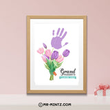 Grandparents Day printable handprint keepsake featuring a watercolor-style bouquet of pink and purple tulips with green leaves, a large purple child handprint above the flowers, and “Grandparents, I Love You” lettering, designed for children ages 3–7 to create a personalized floral gift that both grandparents can display and save.