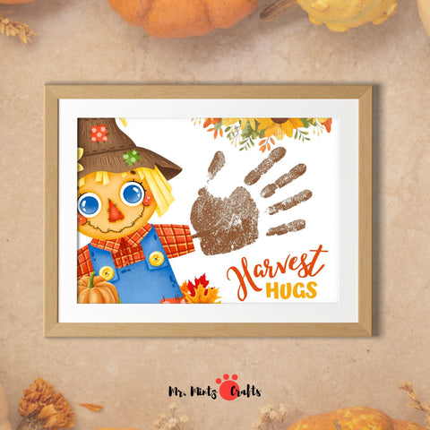 Harvest Handprint Scarecrow Craft for kids with ‘Harvest Hugs’ and a colorful scarecrow design.