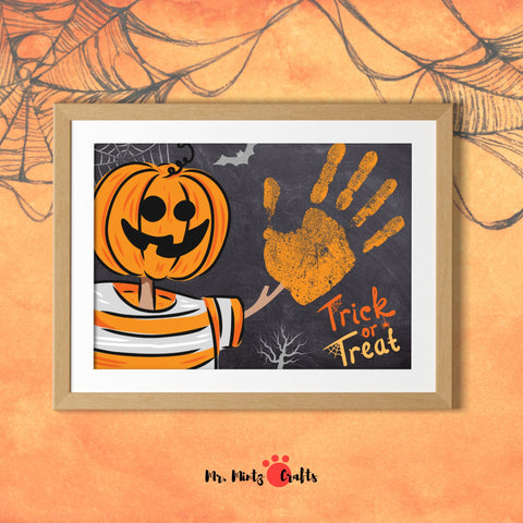 Halloween craft featuring a pumpkin-headed figure and orange handprint on a chalkboard background with “Trick or Treat” text