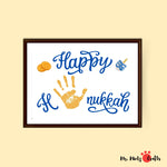 Happy Hanukkah printable with a child's handprint, dreidel, and coins, ideal for a personalized holiday craft or festive decor.