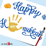 Happy Hanukkah printable with a child's handprint, dreidel, and coins, ideal for a personalized holiday craft or festive decor.