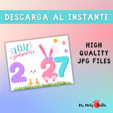 Imprimible de Pascua 2027 “Feliz Páscoa” para niños, ideal como manualidad en casa o en el aula. El diseño presenta una huella de mano en forma de pollito, orejas de conejo sobre el número dos, césped decorativo y flores de colores. Perfecto para celebrar Pascua con actividades creativas y educativas en preescolar, jardín o educación infantil. Incluye dos formatos JPG: A4 y carta.