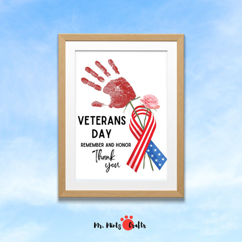 Veterans Day handprint craft for preschool and kindergarten kids featuring a red handprint, patriotic ribbon, and ‘Thank You’ message for honoring veterans.