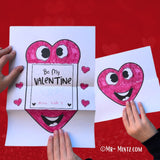 Printable folding heart card with customizable message space and vibrant designs for Valentine’s Day.