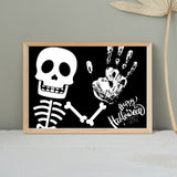This Halloween Skeleton handprint art craft is perfect is an easy personalized gift for mom, dad, grandma, grandpa or any family member!