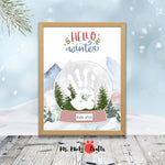 Snow Globe Handprint Craft for kids featuring a printable template with a ‘Hello Winter’ message, perfect for creating personalized winter keepsakes.