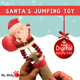 Santa Claus in Motion origami craft featuring a jumping Santa toy with fan-folded legs, ideal for kids’ Christmas fun.